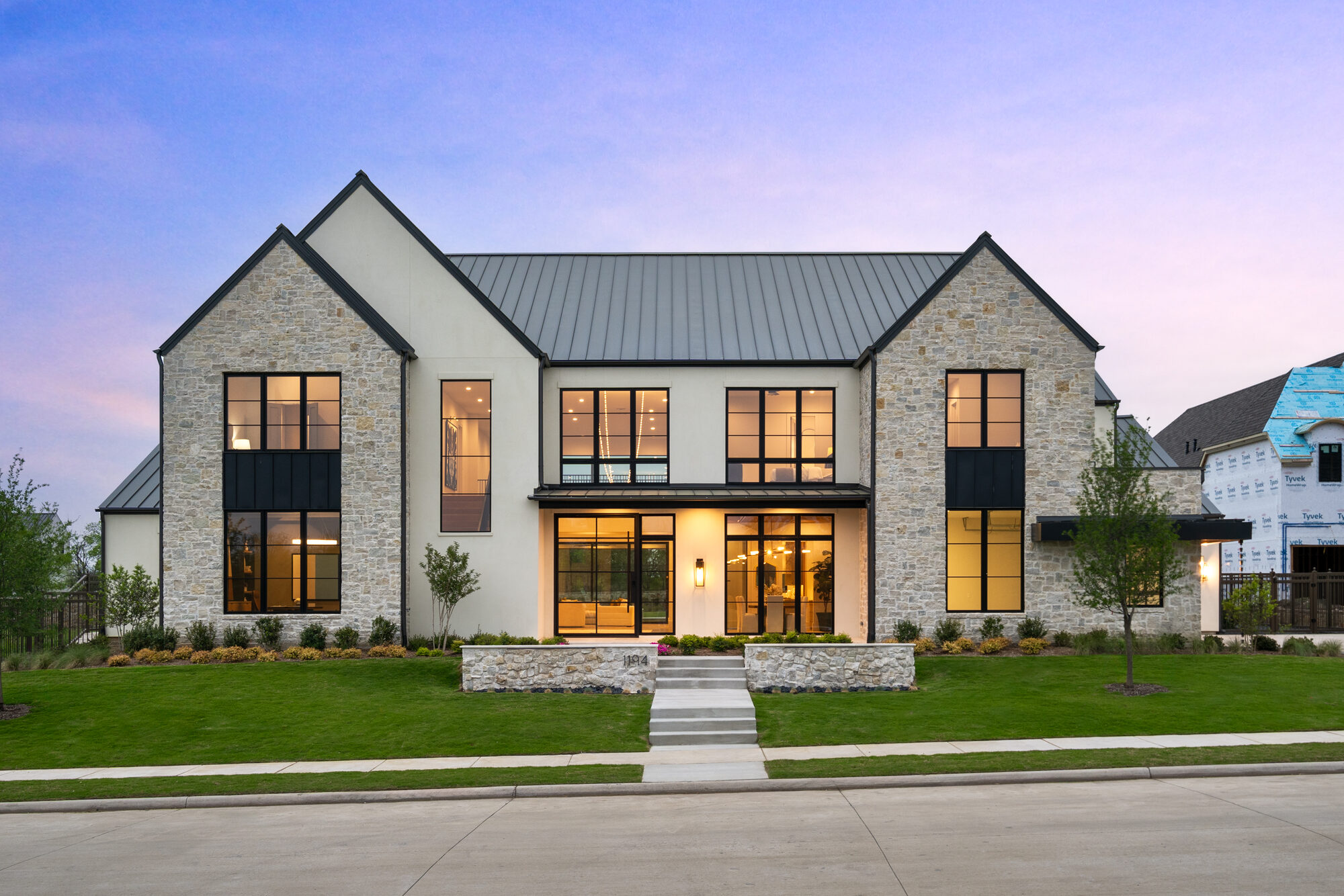 Modern home at dusk from a listing film